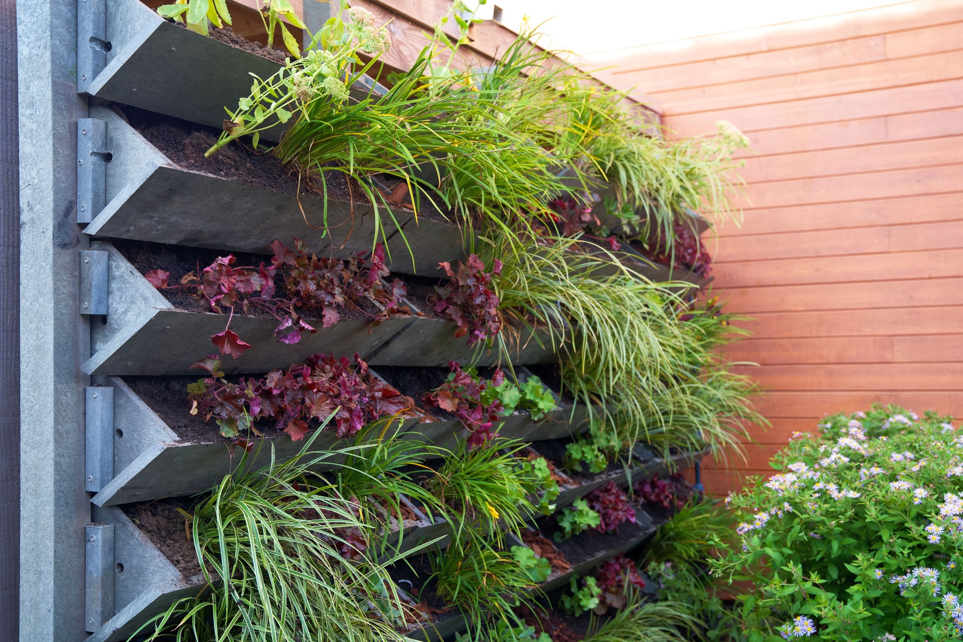 Vertical green wall garden made from recycled waste plastics on behalf of climate adaptation